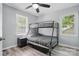 Bedroom with bunk beds, ceiling fan, and natural light at 2224 Clonmel Pl, Charlotte, NC 28262