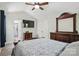Spacious bedroom with a ceiling fan and a flat screen television at 2224 Clonmel Pl, Charlotte, NC 28262