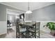 Light-filled dining room featuring a round table with seating for four and views into the living area at 2224 Clonmel Pl, Charlotte, NC 28262