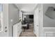 Bright entryway showcasing stylish flooring, fresh paint, modern accents, and seamless flow into the living area at 2224 Clonmel Pl, Charlotte, NC 28262