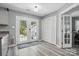 Hallway featuring a view to the backyard, white closets, and luxury vinyl plank flooring at 2224 Clonmel Pl, Charlotte, NC 28262