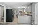 Open kitchen featuring stainless appliances, gray cabinets and countertops, and durable flooring at 2224 Clonmel Pl, Charlotte, NC 28262