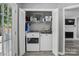 Bright laundry room featuring a new washer and dryer, white cabinets, and durable flooring at 2224 Clonmel Pl, Charlotte, NC 28262