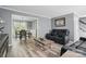 Open-concept living area with comfortable seating, a stylish coffee table, and a view into the adjacent dining space at 2224 Clonmel Pl, Charlotte, NC 28262