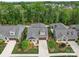 Beautiful aerial view of a house with well-maintained landscaping and a long driveway at 2306 Wesley Landing Rd, Waxhaw, NC 28173