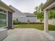 View of backyard with a concrete patio and small lawn and garden areas at 2306 Wesley Landing Rd, Waxhaw, NC 28173