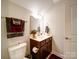 Compact bathroom features a vanity with a sink, a toilet and neutral wall color at 2306 Wesley Landing Rd, Waxhaw, NC 28173