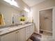 Bright bathroom with a double vanity, granite countertop, and access to toilet room at 2306 Wesley Landing Rd, Waxhaw, NC 28173