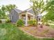 Charming home with a well-manicured lawn and lush landscaping at 2306 Wesley Landing Rd, Waxhaw, NC 28173
