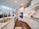 Well-lit kitchen featuring stainless steel appliances, granite countertops, and white cabinetry at 2306 Wesley Landing Rd, Waxhaw, NC 28173