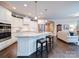 Bright kitchen with stainless steel appliances, granite countertops, and a breakfast bar at 2306 Wesley Landing Rd, Waxhaw, NC 28173