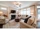 Inviting living room with a fireplace and plenty of natural light from large windows at 2306 Wesley Landing Rd, Waxhaw, NC 28173