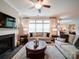 Bright living room showcasing a fireplace, large windows, and comfortable seating at 2306 Wesley Landing Rd, Waxhaw, NC 28173