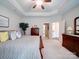 Inviting main bedroom featuring a tray ceiling, neutral decor, and an en-suite bathroom at 2306 Wesley Landing Rd, Waxhaw, NC 28173