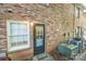 Backyard view of a brick building featuring window and exterior door at 2332 Kenmore Ave, Charlotte, NC 28204