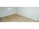 Bright, modern bedroom featuring clean floors and a large window for ample natural light at 2332 Kenmore Ave, Charlotte, NC 28204