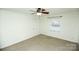 Bedroom featuring ceiling fan and large window at 2332 Kenmore Ave, Charlotte, NC 28204
