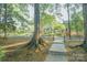 View of the community buildings behind a sidewalk and trees at 2332 Kenmore Ave, Charlotte, NC 28204