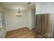 Bright dining area with modern light fixture, stainless steel refrigerator, and plenty of room for dining at 2332 Kenmore Ave, Charlotte, NC 28204