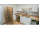 Updated kitchen with stainless appliances, granite counters, and bright white cabinets at 2332 Kenmore Ave, Charlotte, NC 28204