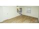 Well-lit living space featuring hard surface floors and staircase to upper level at 2332 Kenmore Ave, Charlotte, NC 28204