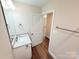 Bright bathroom featuring a modern vanity, chrome fixtures, and wood-look flooring at 288 Tram Rd, Lancaster, SC 29720