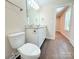 Bathroom featuring a granite countertop vanity, toilet, hardwood floors, and modern lighting fixtures at 288 Tram Rd, Lancaster, SC 29720