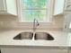 Modern stainless steel sink with granite countertops and a bright window view at 288 Tram Rd, Lancaster, SC 29720