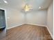A spacious bedroom with modern flooring and a ceiling fan at 296 Tram Rd, Lancaster, SC 29720