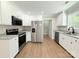 Spacious kitchen with stainless steel appliances, granite countertops, and white cabinets at 296 Tram Rd, Lancaster, SC 29720