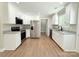 Bright kitchen featuring modern stainless steel appliances, white cabinetry, and granite countertops at 296 Tram Rd, Lancaster, SC 29720