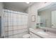 Bright bathroom featuring shower with coordinating shower curtain, vanity and modern sink at 3017 Winged Teal Ct, Belmont, NC 28012
