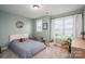 Bright bedroom featuring a bed, dresser, natural lighting and colorful toys at 3017 Winged Teal Ct, Belmont, NC 28012
