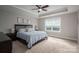 Relaxing bedroom with tray ceiling, ceiling fan and three botanical prints on the wall at 3017 Winged Teal Ct, Belmont, NC 28012