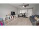 Large bonus room with ceiling fan, shelving unit, TV, weights and exercise bike at 3017 Winged Teal Ct, Belmont, NC 28012