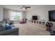 Spacious bonus room features a ceiling fan, large window and a built-in bookcase at 3017 Winged Teal Ct, Belmont, NC 28012