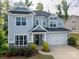 Charming two-story home with a well-manicured lawn and welcoming front porch at 3017 Winged Teal Ct, Belmont, NC 28012