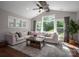 Bright living room with vaulted ceiling, large windows and comfortable L-shaped couch at 3017 Winged Teal Ct, Belmont, NC 28012