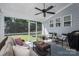 Screened-in porch with ceiling fan overlooking large backyard at 3017 Winged Teal Ct, Belmont, NC 28012