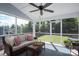 Cozy screened porch with ceiling fan and view of backyard at 3017 Winged Teal Ct, Belmont, NC 28012