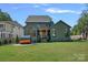 Spacious backyard featuring a barrel sauna and stylish exterior at 3209 Mayfield Ave # 11, Charlotte, NC 28209