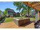 Outdoor living space with a wooden deck, comfortable seating, fire pit and well-maintained lawn at 3209 Mayfield Ave # 11, Charlotte, NC 28209