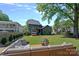 Backyard featuring outdoor seating, privacy fence, barrel sauna, and lush lawn at 3209 Mayfield Ave # 11, Charlotte, NC 28209