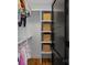 Organized closet with shelves, hanging clothes, and decorative storage baskets offers ample space at 3209 Mayfield Ave # 11, Charlotte, NC 28209