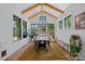 Bright dining room with vaulted ceilings, exposed beams, and large windows at 3209 Mayfield Ave # 11, Charlotte, NC 28209