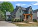 Charming home with a covered porch, a two-car garage, and fresh landscaping at 3209 Mayfield Ave # 11, Charlotte, NC 28209
