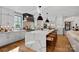 Bright kitchen featuring a long island with seating, pendant lights, and a modern range hood at 3209 Mayfield Ave # 11, Charlotte, NC 28209