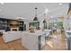 Spacious open floor plan with modern kitchen island, fireplace, and dining area at 3209 Mayfield Ave # 11, Charlotte, NC 28209