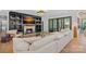 Cozy living room featuring a fireplace, built-in bookshelves, and sliding doors leading to outdoor living at 3209 Mayfield Ave # 11, Charlotte, NC 28209
