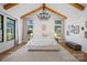 Bright main bedroom boasting vaulted ceilings, hardwood floors, and a large window at 3209 Mayfield Ave # 11, Charlotte, NC 28209